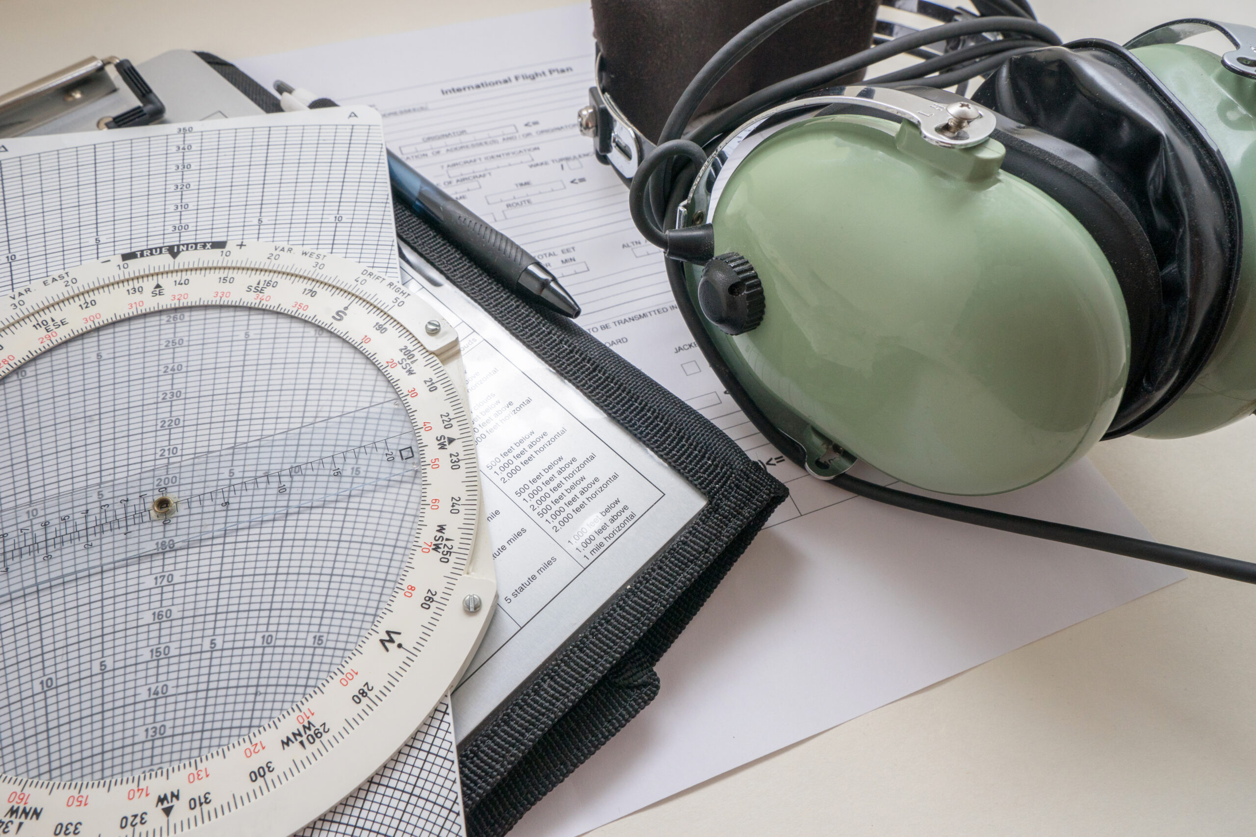 close-up-equipment-with-headphones-papers-table